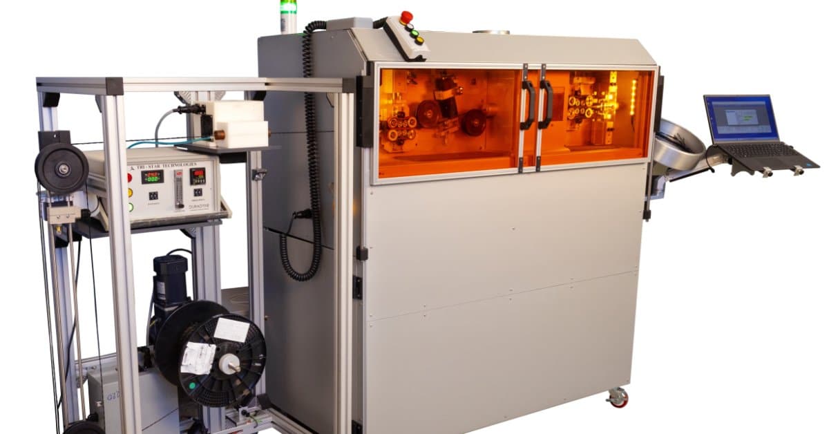 The Tri-Star Technologies industrial inkjet marking system with a laptop against a blank background.