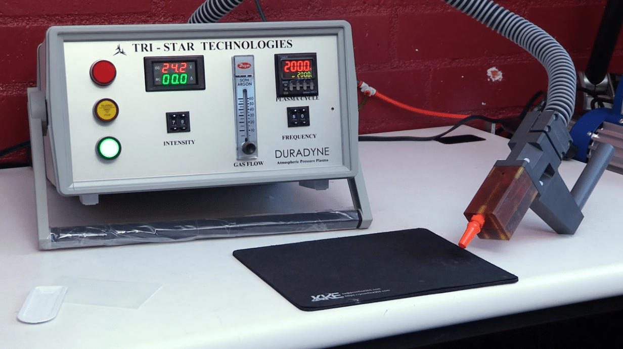 A close-up of the Tri-Star Technologies Duradyne Atmospheric Pressure Plasma System on a white desk.