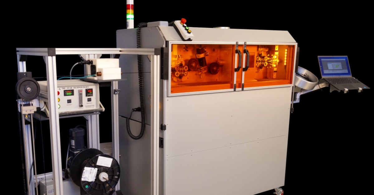 The Tri-Star Technologies industrial M-100J inkjet industrial marking system full assembly on wheels.