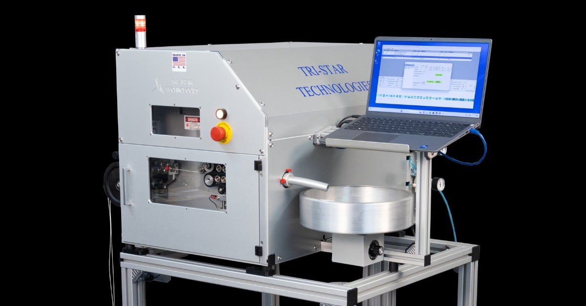 The Tri-Star Technologies M-100L-FG-TT-A industrial laser wire marking system assembly on a car with wheels.